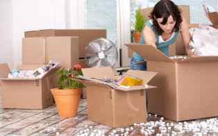 woman-surrounded-by-open-packing-boxes-xlarge